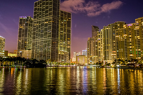 This is a stock photo. The Brickell neighborhood in downtown Miami at night.