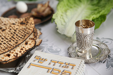 This is a stock photo. A close up view of a Passover Seder table.
